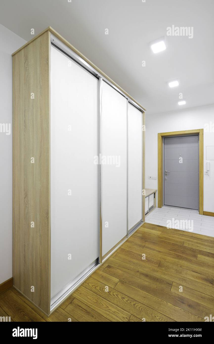 White Sliding Wardrobe In The Hallway Stock Photo - Alamy intended for