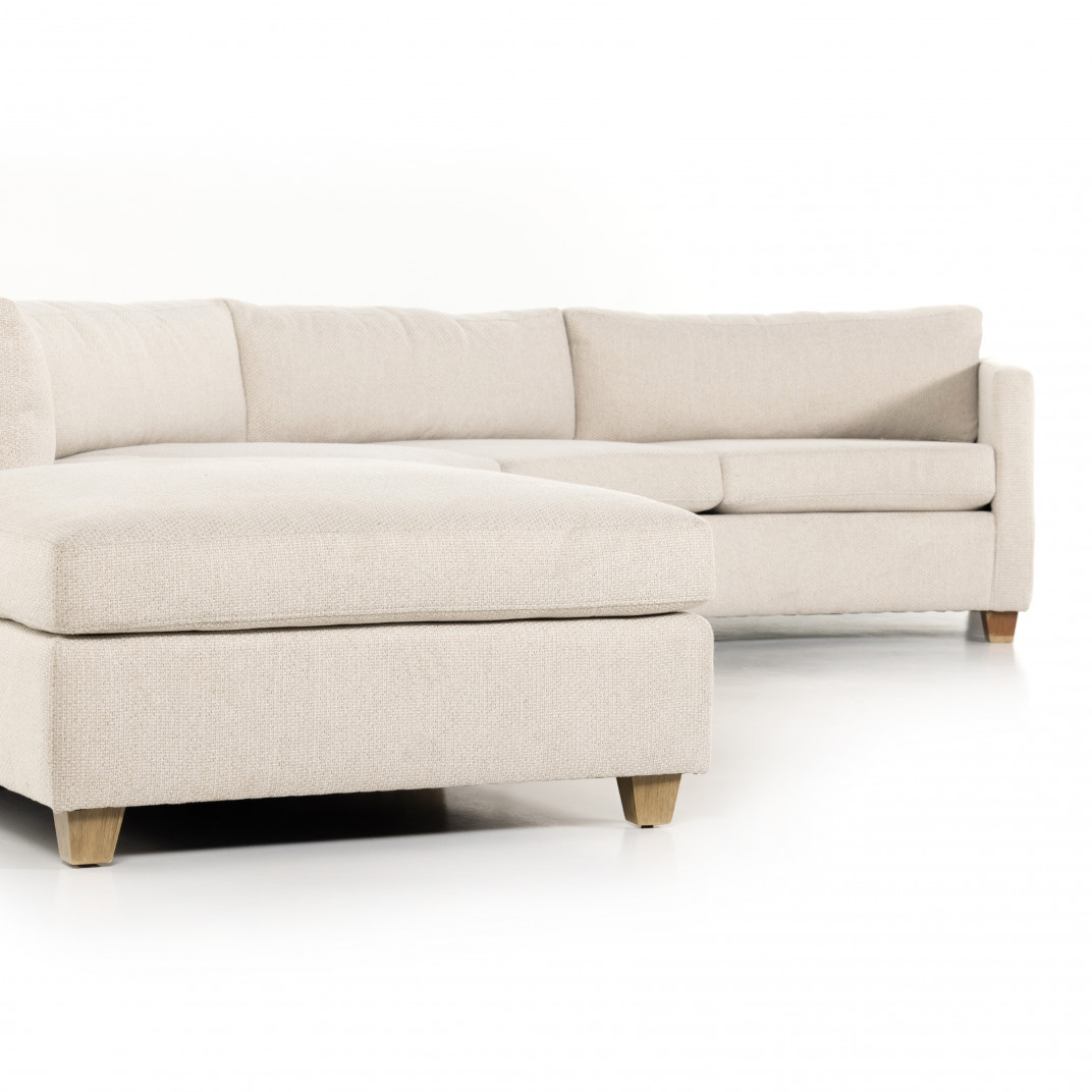 The Versatility of a Right-Arm Facing Sectional Enhanced by a Beige Ottoman
