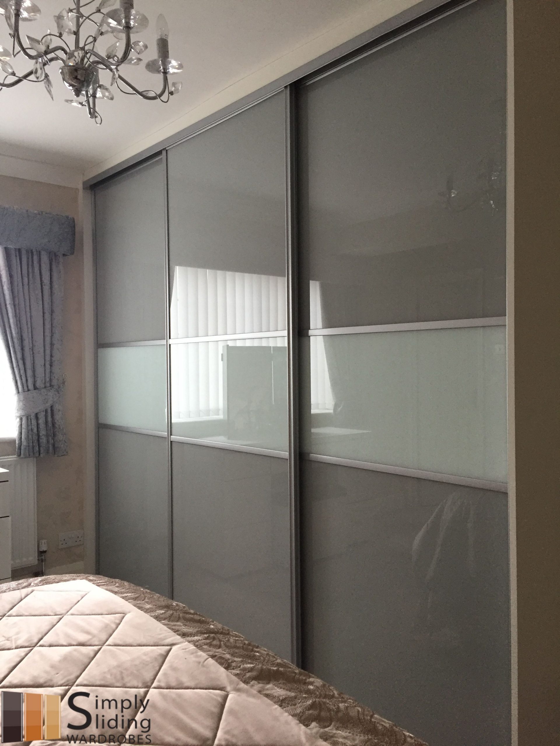 One Of Our Multi Panel Grey Glass Sliding Door Wardrobes. | Sliding ... throughout Maximizing Space and Style with a Light Gray Sliding Door Wardrobe