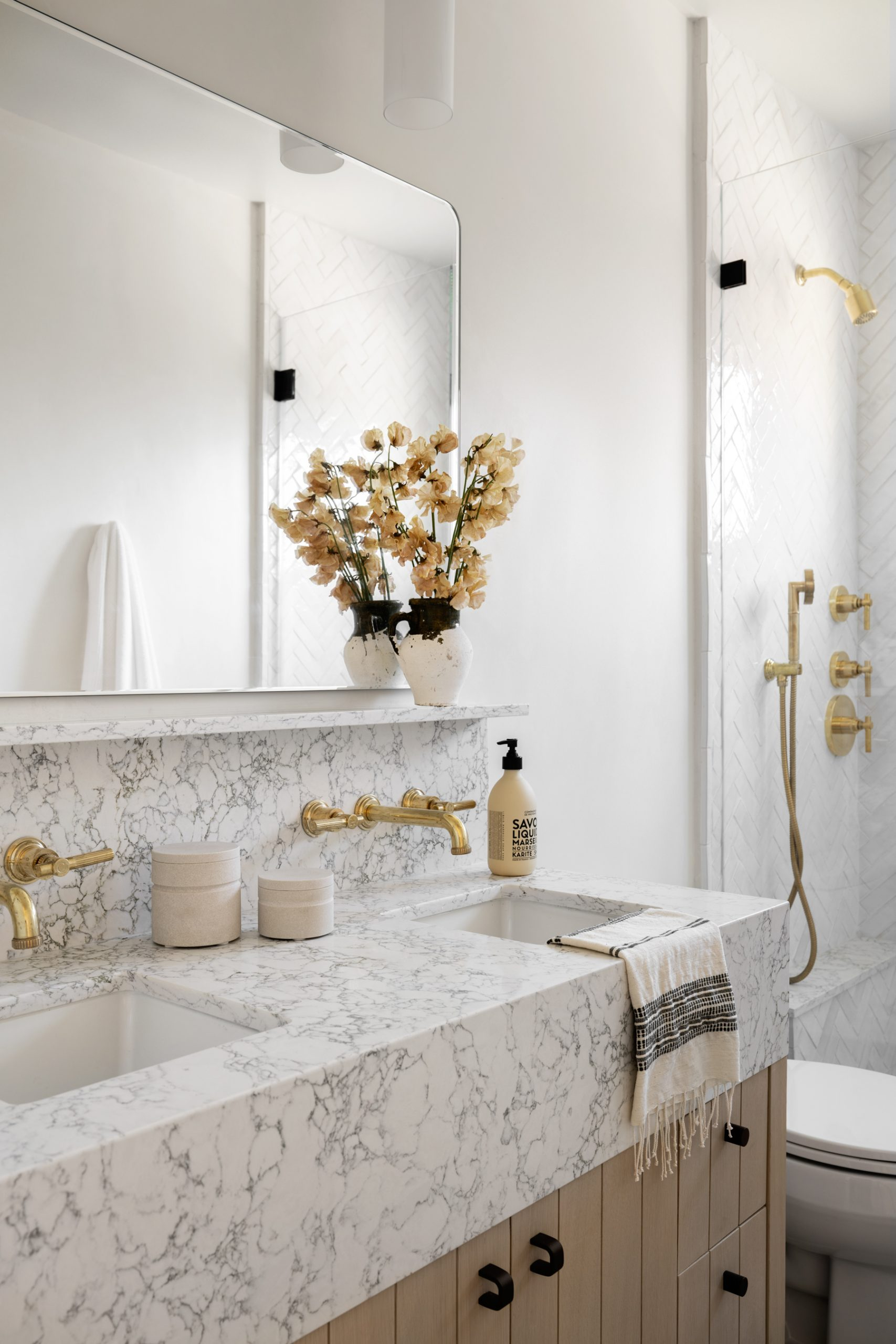 Designing Your Bathroom Sanctuary with Classic White and Gold Accents