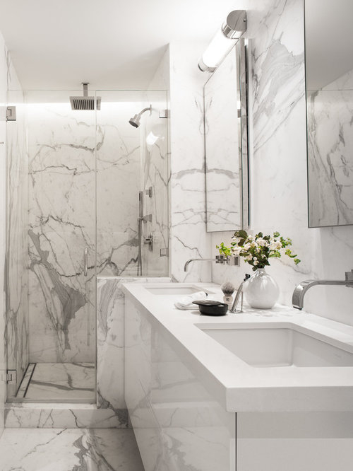Creating luxury bathroom spaces with Carrara white marble and contemporary hardware